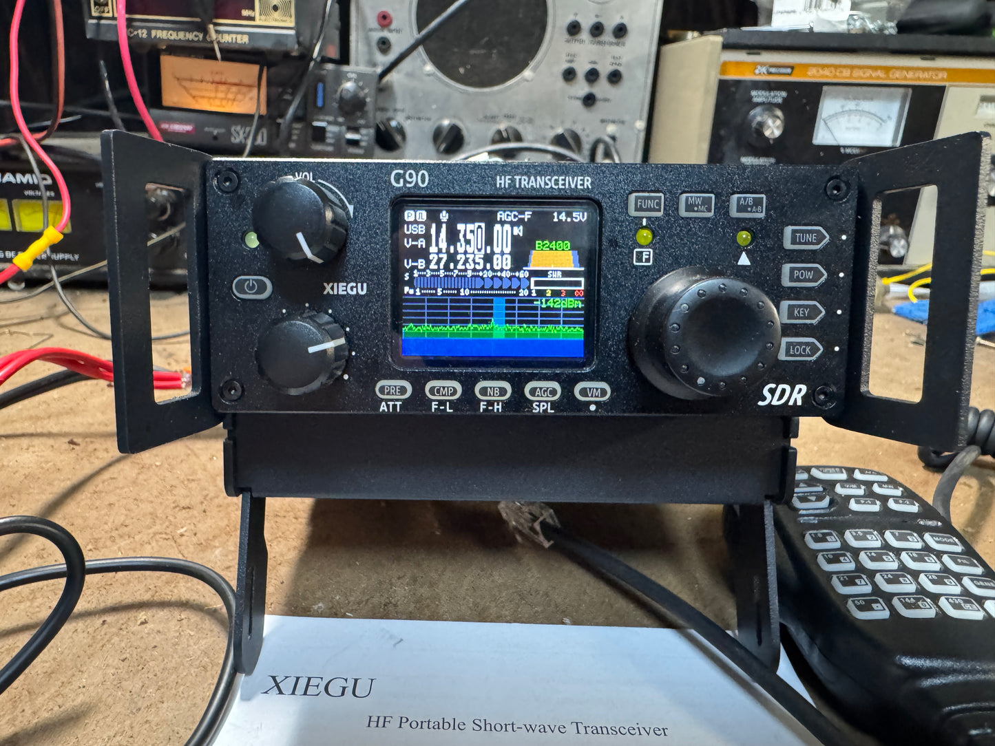 XIEGU HF Portable Short-wave Transceiver with digital display on a cluttered background
