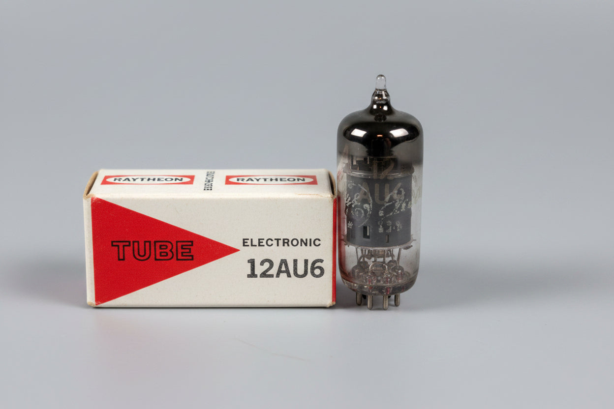 Raytheon 12AU6 vacuum tube with packaging on a blue surface