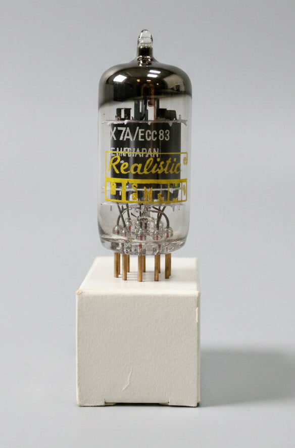 Vacuum tube with 'Realistic' branding on a gray background