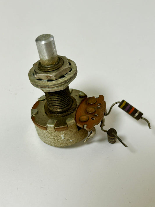 Vintage potentiometer with wiring on a white background