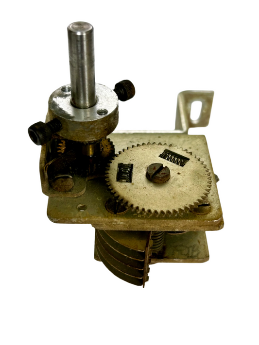 Mechanical component with gears and springs on a white background