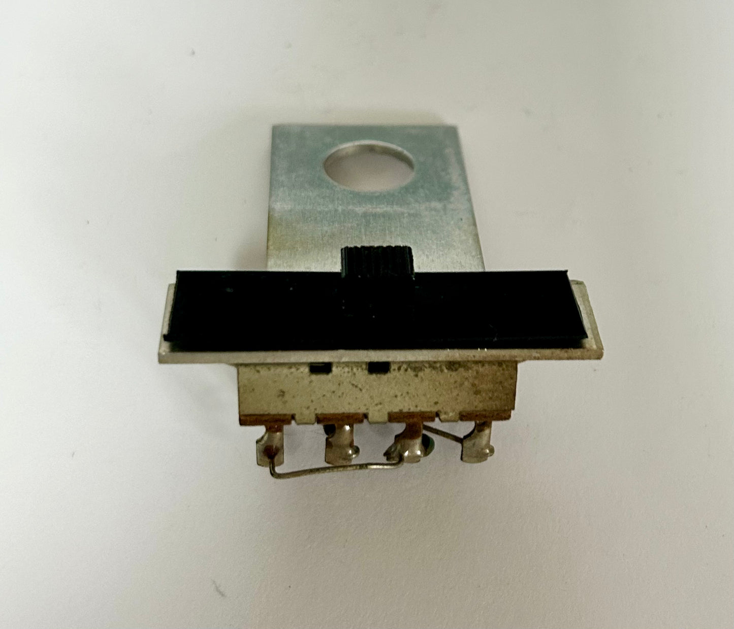 Mechanical switch component on a white background