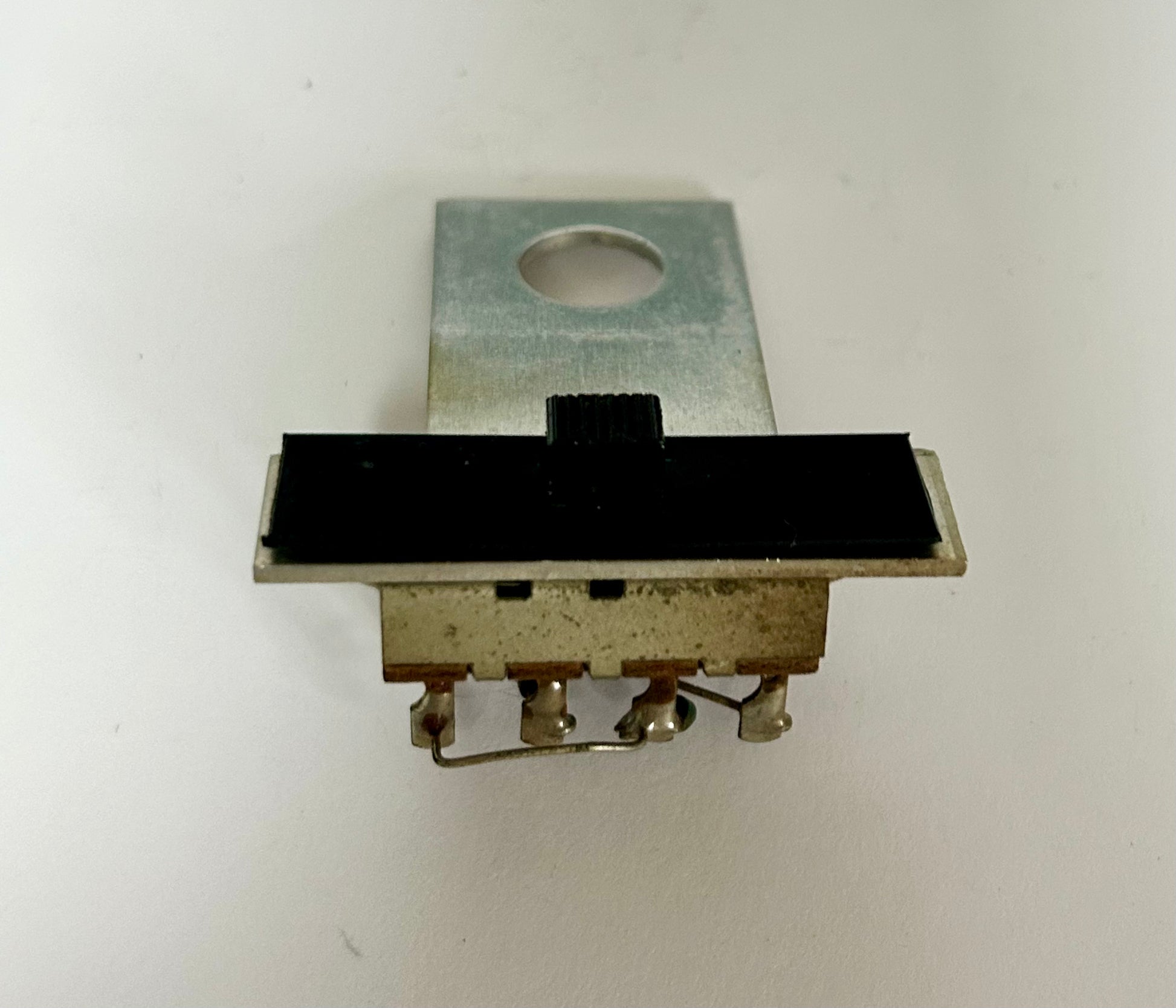 Mechanical switch component on a white background