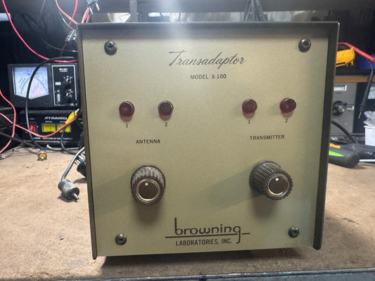 Transadaptor model X-100 with 'browning laboratories, Inc.' branding on a workshop background.