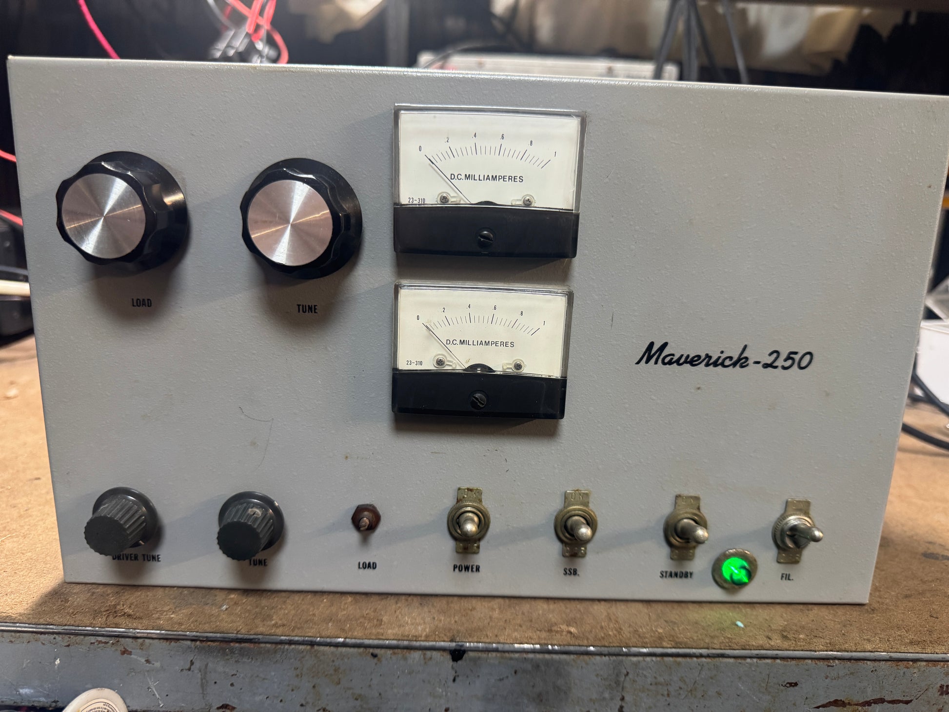 Vintage electronic device with dials and indicators labeled 'Maverick-250'.